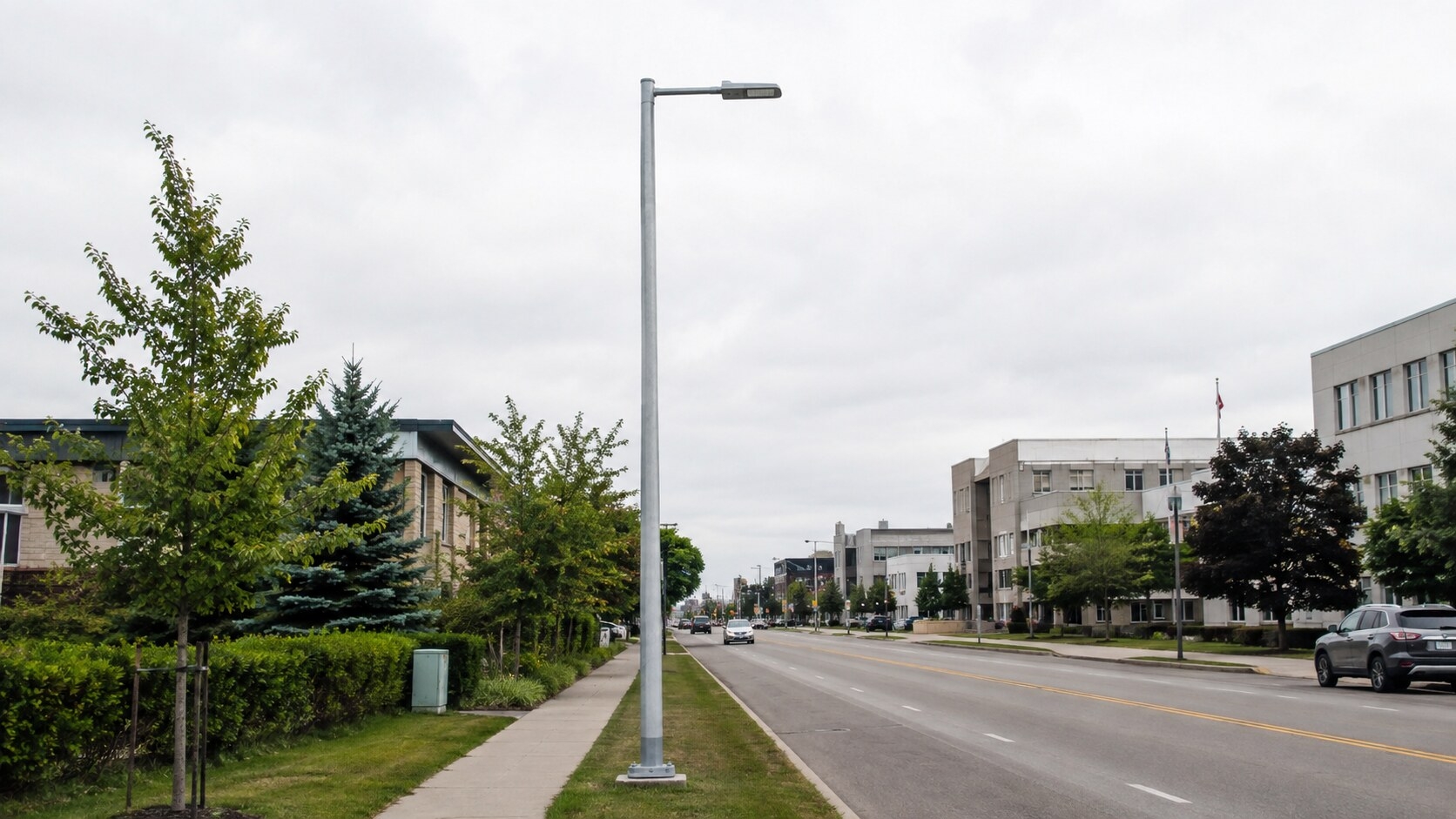8m galvanized octagonal street light pole installed beside a municipal road
