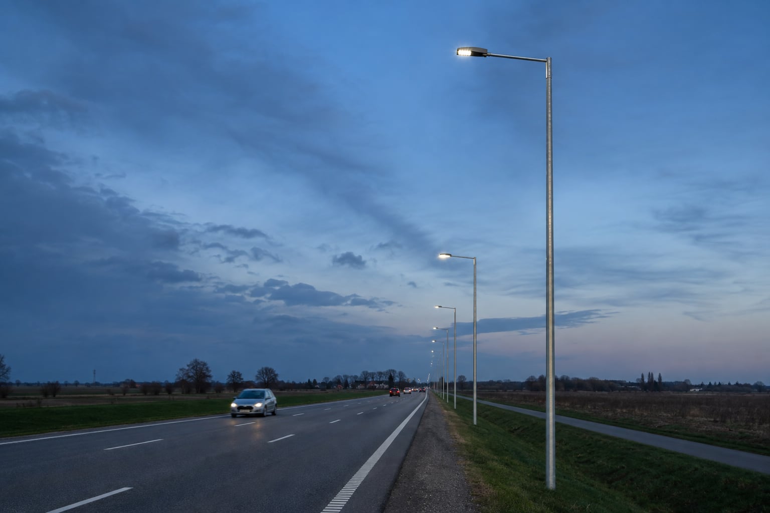 Direct burial street light poles along an arterial road